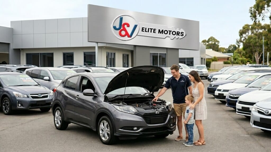 Couple checking under the bonnet — used car buying guide.